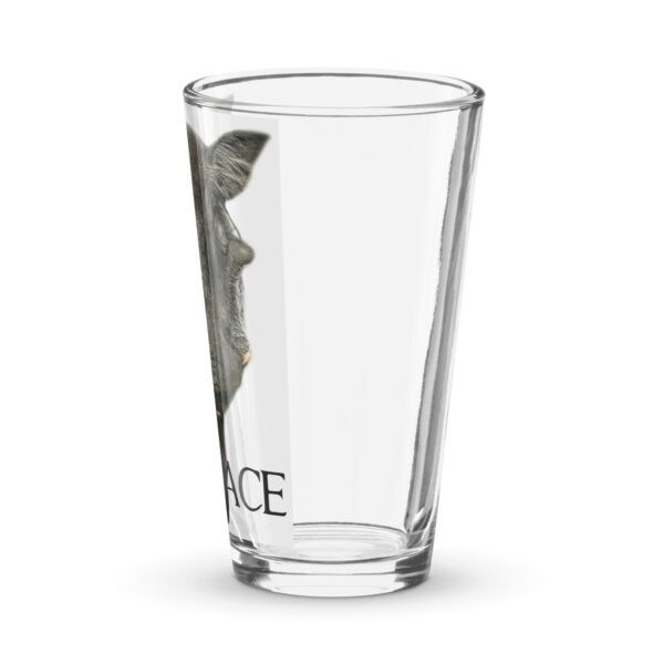 A glass with the image of a person in a mask.