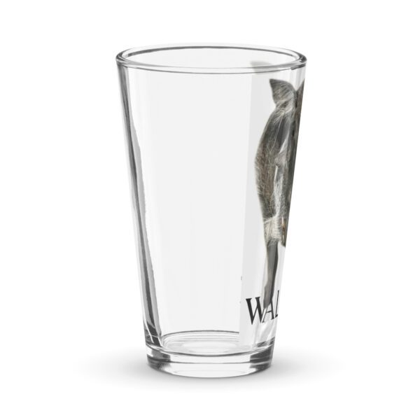 A glass with a cat inside of it