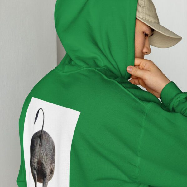 A person wearing a green hoodie with an image of a cat on it.