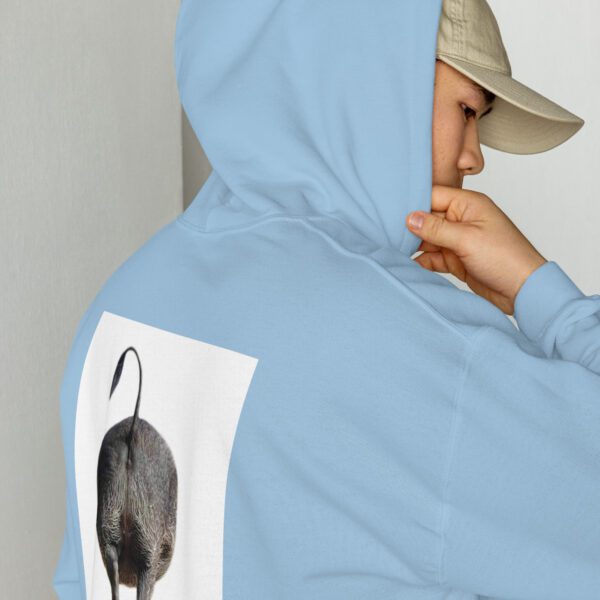 A person wearing a hat and jacket with an image of a mouse.