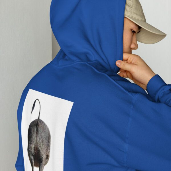 A person wearing a blue jacket with an image of a mouse on it.