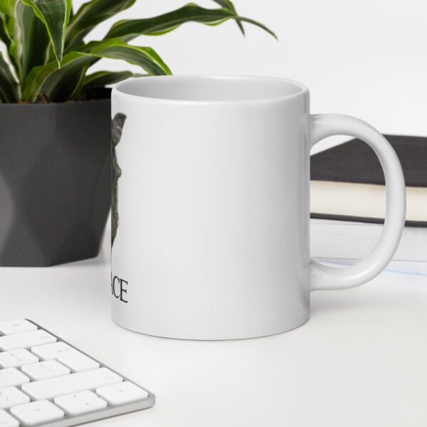 A coffee mug sitting on top of a desk.