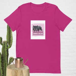 A magenta t-shirt with a graphic design of elephants and text.